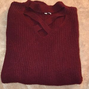 Maroon sweater with cross neck detail